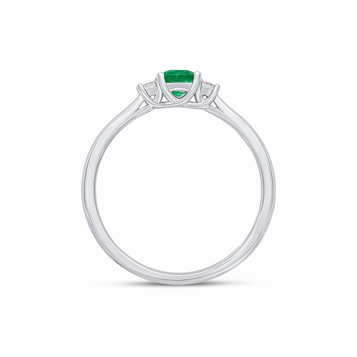 18ct white gold cushion cut Emerald and princess cut Diamond claw set three stone ring