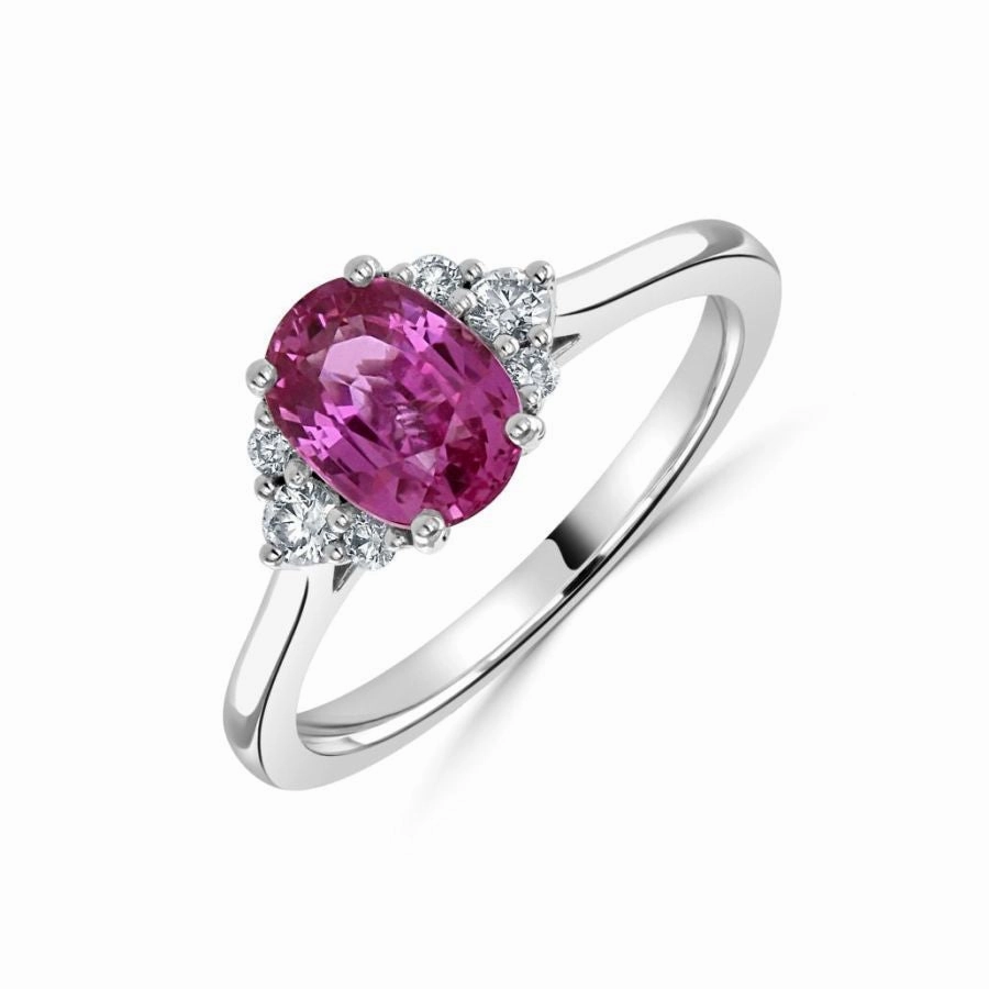 18ct white gold oval pink sapphire and diamond trefoil sides ring all claw set