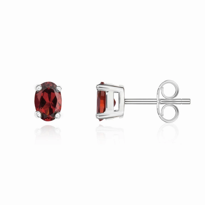 9ct white gold 6x4mm oval garnet claw set stud earrings