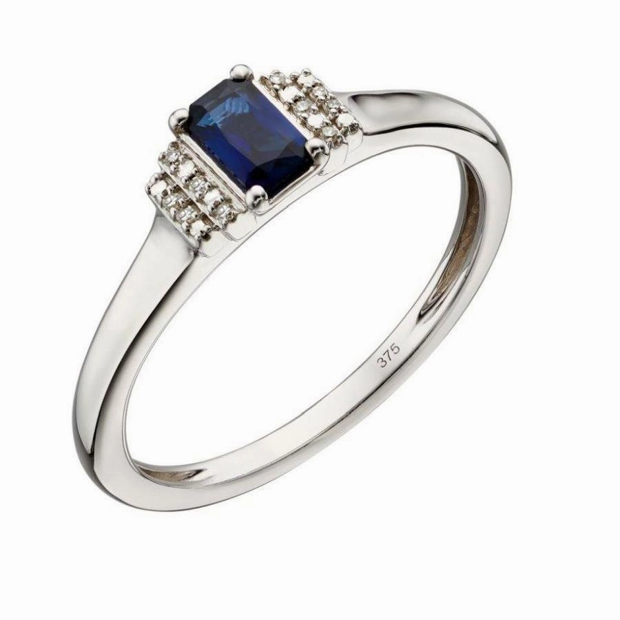 9ct White Gold Emerald Cut Sapphire & Stepped Diamond Shoulders Ring